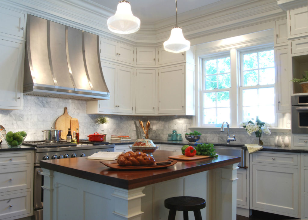 white kitchen with black countertops