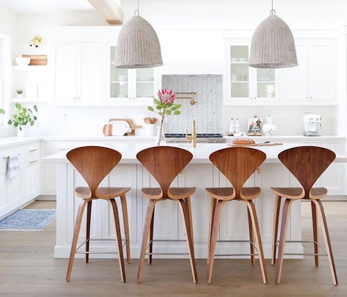 midcentury chairs in traditional kitchen