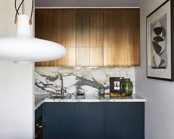 blue and brass kitchen cabinets