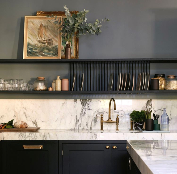 black kitchen with open shelves for dishes