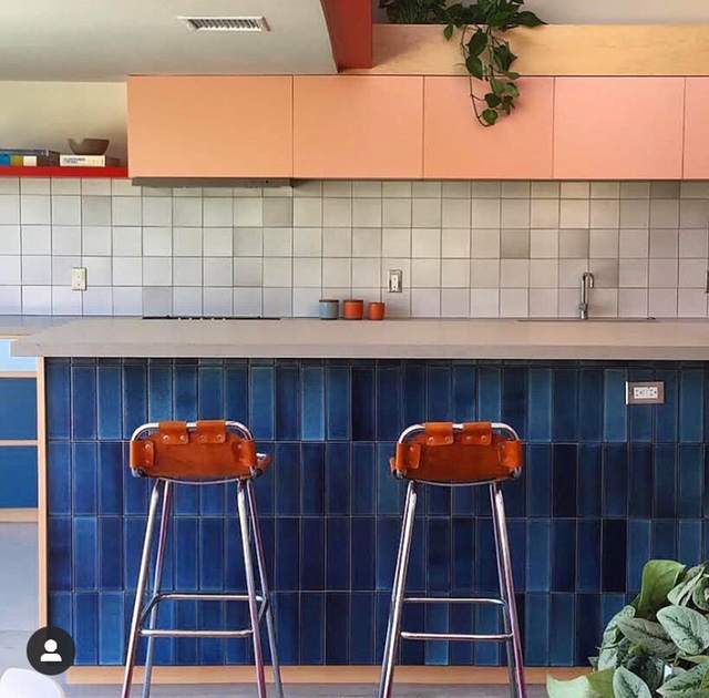 blue and gray tiled backsplash and island
