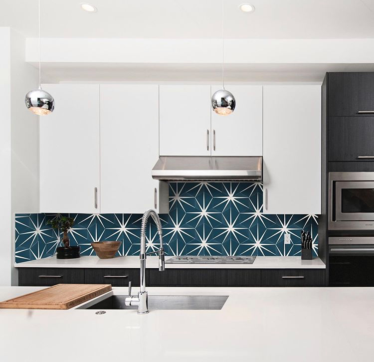 blue and white geometric tiled kitchen backsplash
