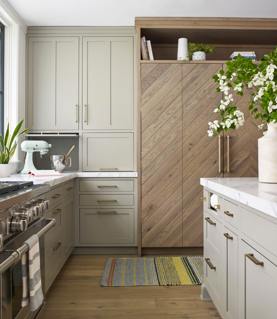 gray and wood kitchen with paneled appliances