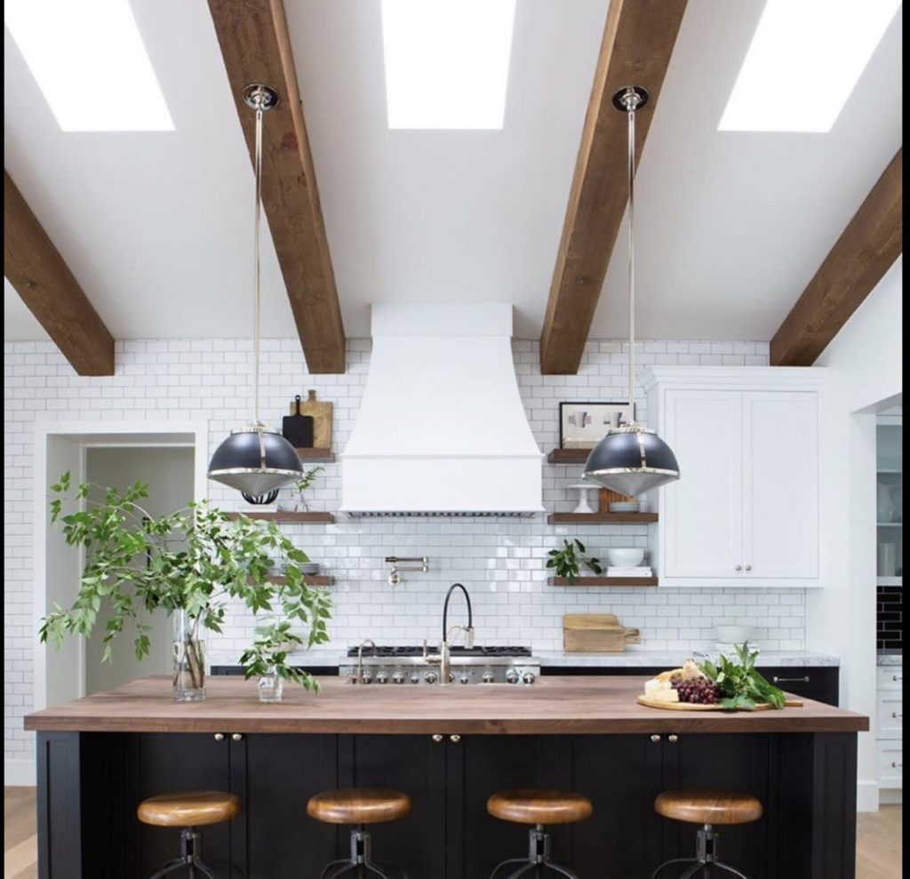 black and white kitchen with wood details