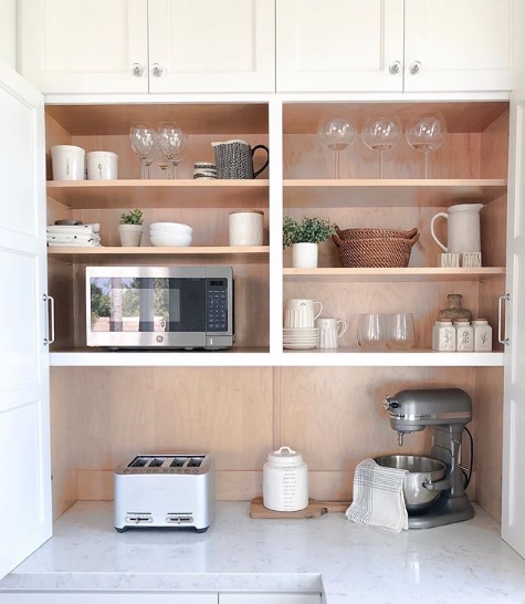 breakfast bar with shelves in kitchen
