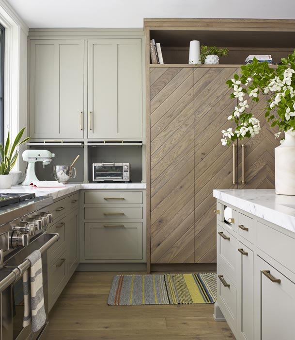gray and wood kitchen cabinets and paneled appliance