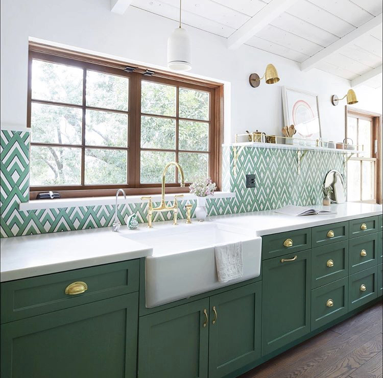 kitchen with green accents and cabinets