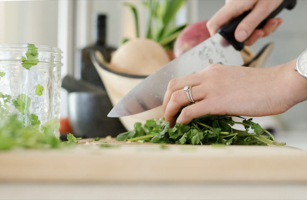 woman cutting parsley