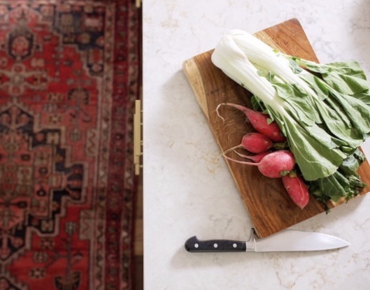 vegetables on a cutting board with knife