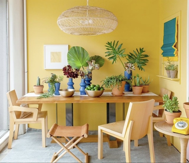 bright yellow dining area with colorful accents