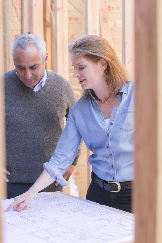 man and woman working on design layout