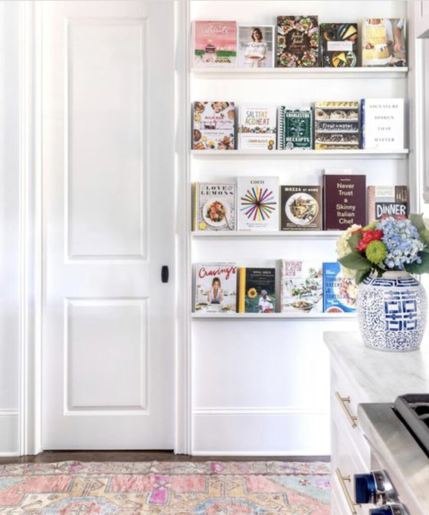 shelves with cookbooks in kitchen