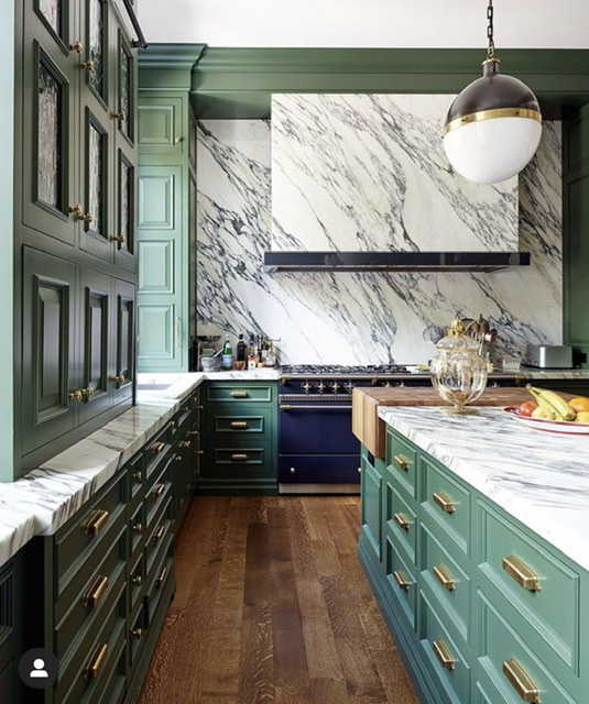 green and white kitchen with black and white marble