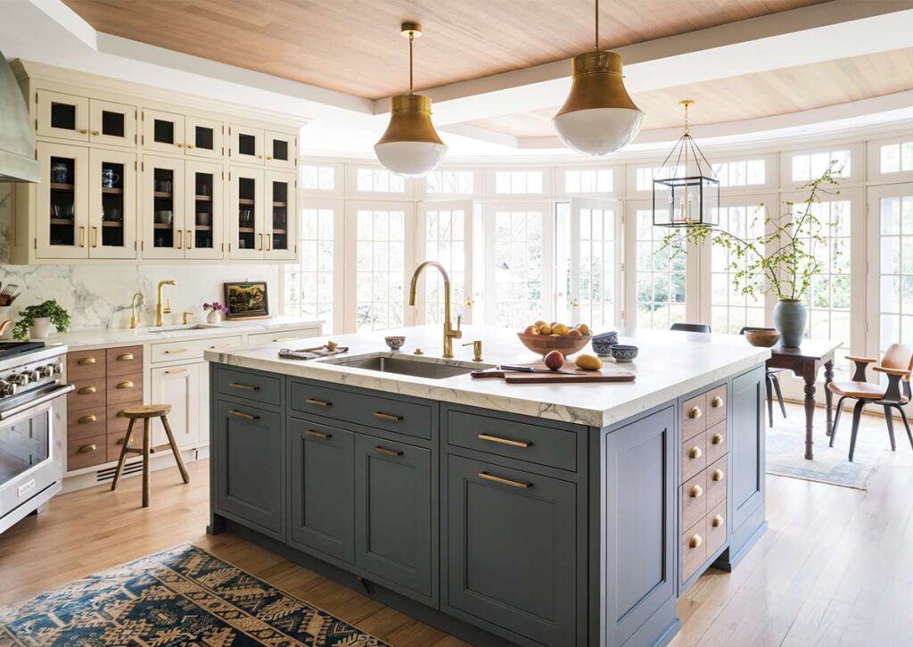 blue kitchen island in white and wood kitchen