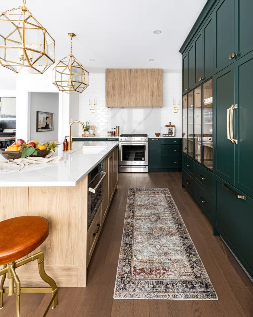 green and wood kitchen with island