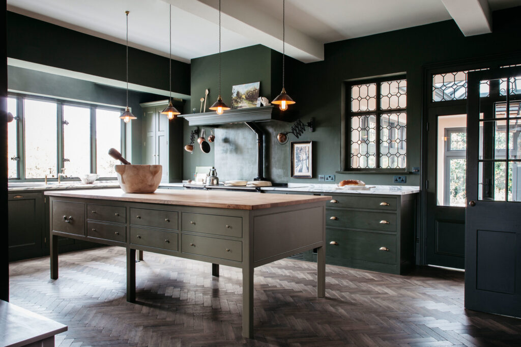 green and industrial kitchen with large island