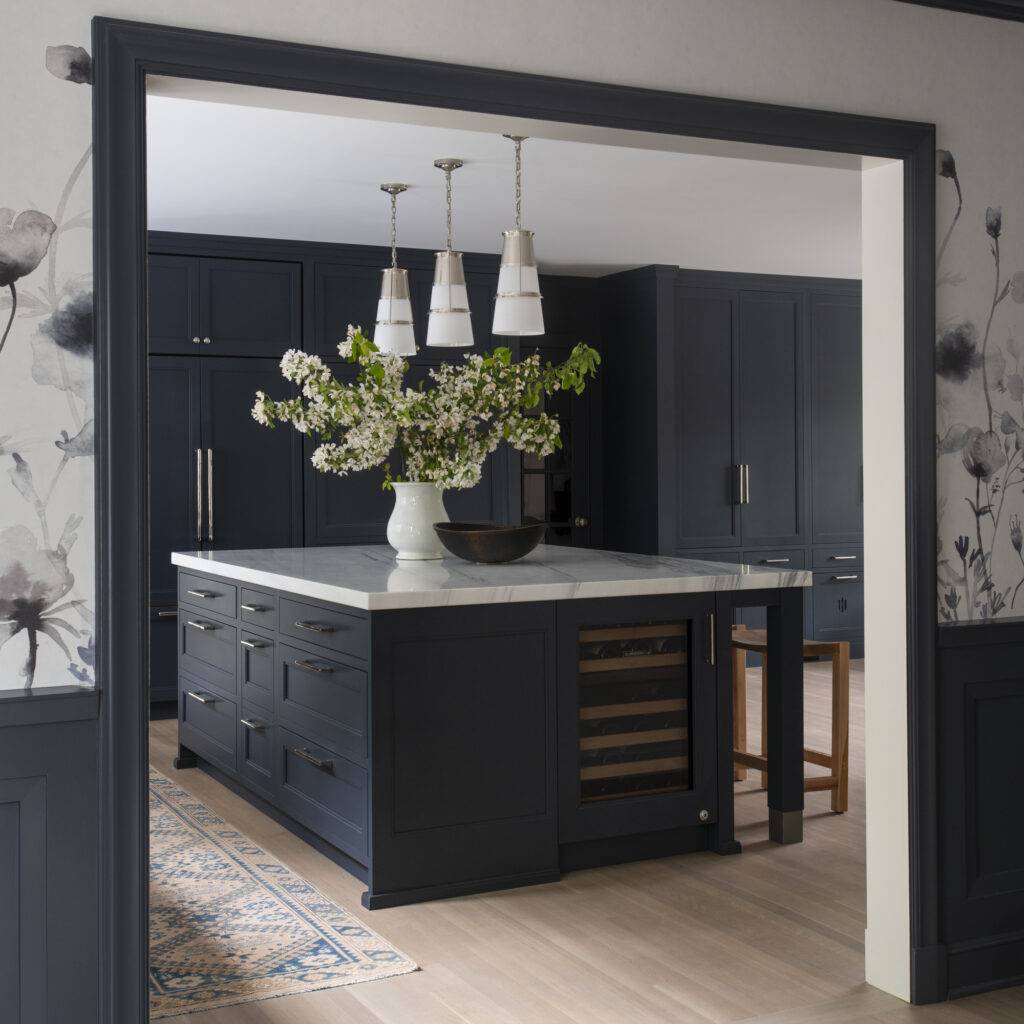 dark cabinet kitchen looking in from dining room
