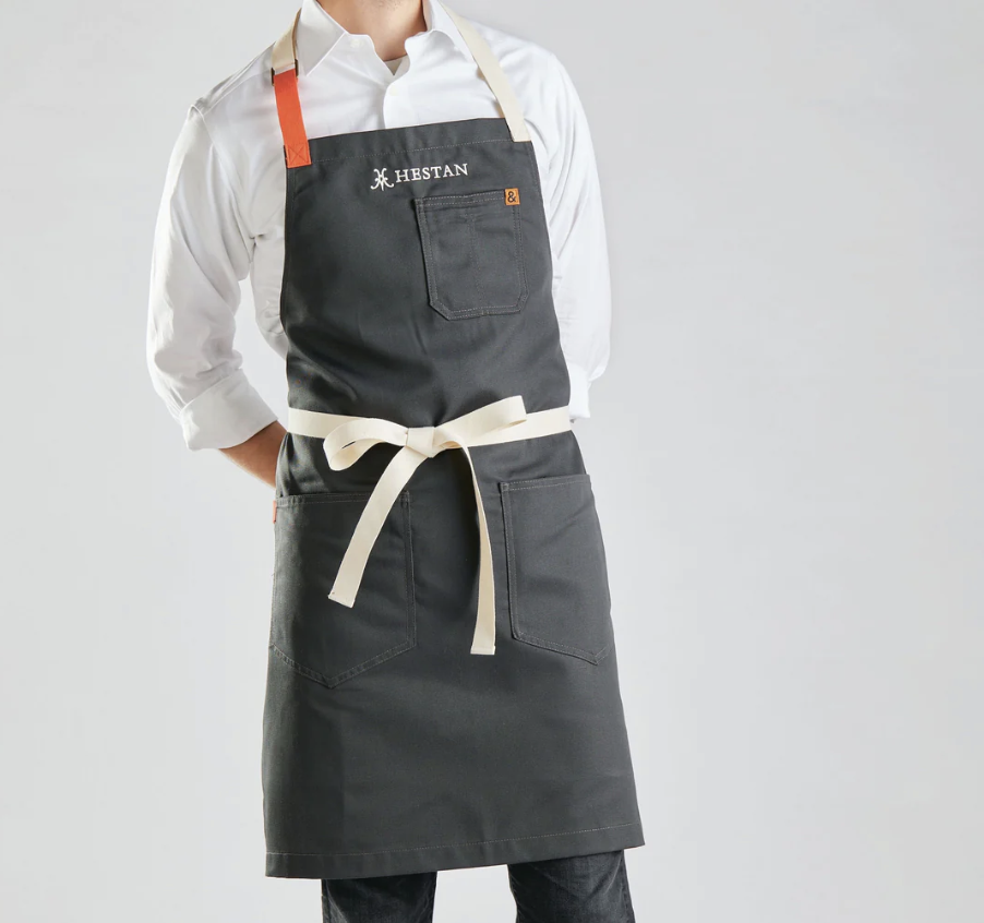 man with apron and tie