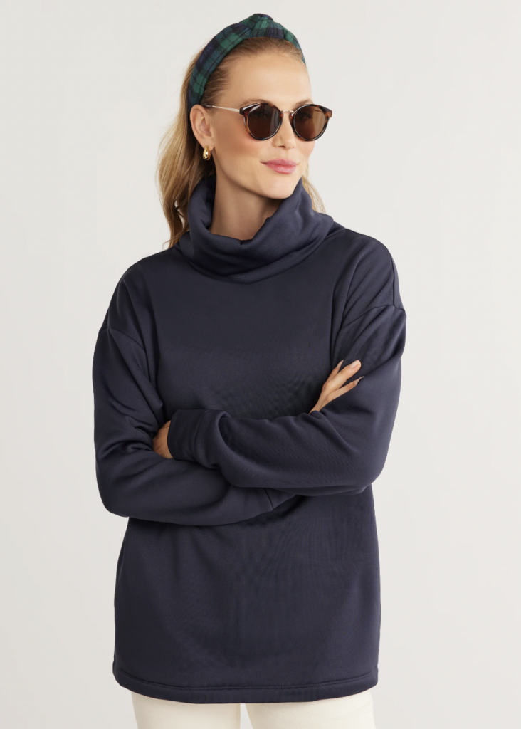 woman wearing sweater and glasses