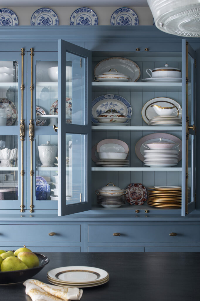 blue cabinet with china inside